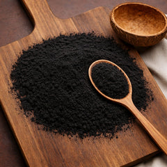 Ultra-fine black activated charcoal powder derived from coconut shells for wellness and culinary use.