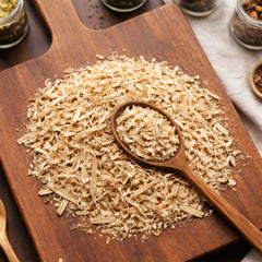 Dried cut and sifted pieces of Aspen Tree Bark (Populus tremuloides) on a white surface – CanadaVitaLife