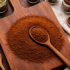 Finely ground dark brown Chaga Powder on a wooden spoon, used for brewing specialty mushroom tea – CanadaVitaLife