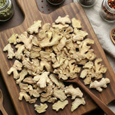Premium dried ginger slices (Zingiber officinale) for traditional botanical infusions and culinary use.