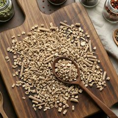 Dry cut and sifted Ashwagandha root (Withania somnifera) for traditional botanical decoctions.