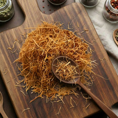 Dry cut and sifted Cat's Claw bark (Uncaria tomentosa) for traditional botanical infusions.