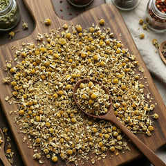 Dry whole Chamomile flowers (Matricaria chamomilla) for traditional botanical infusions.