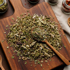 Dried cut and sifted Feverfew herb (Tanacetum parthenium) for traditional brewing.