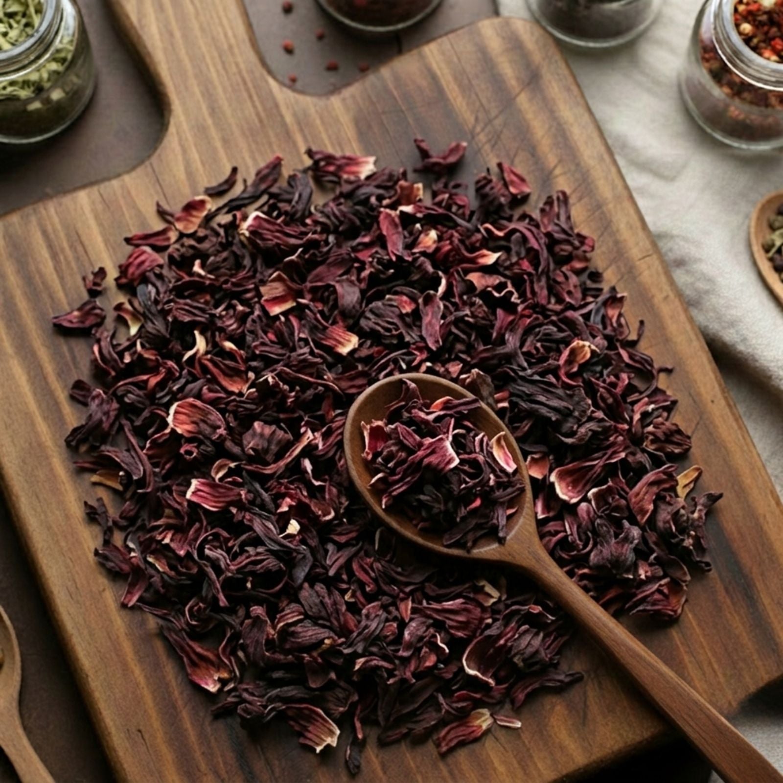 Vibrant crimson cut and sifted Hibiscus flowers (Hibiscus sabdariffa) for traditional tart botanical tea.