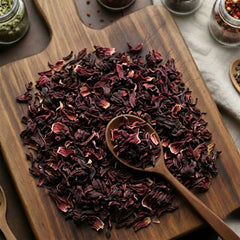 Vibrant crimson cut and sifted Hibiscus flowers (Hibiscus sabdariffa) for traditional tart botanical tea.