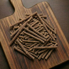 Licorice root sticks (Glycyrrhiza glabra) for traditional sweet botanical infusions.