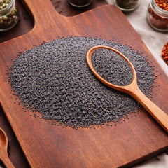 Whole slate-blue poppy seeds (Papaver somniferum) for gastronomic and botanical use.